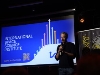 Fabio Crameri, ISSI’s Communication Scientist, taking the stage for a playful but heartfelt introduction to the institute.