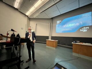 The Surprising Expansion History of the Universe –Public ProISSI Lecture by Nobel Laureate Adam Riess. Shown is Renato Krpoun welcoming the audience. Photo by Fabio Crameri