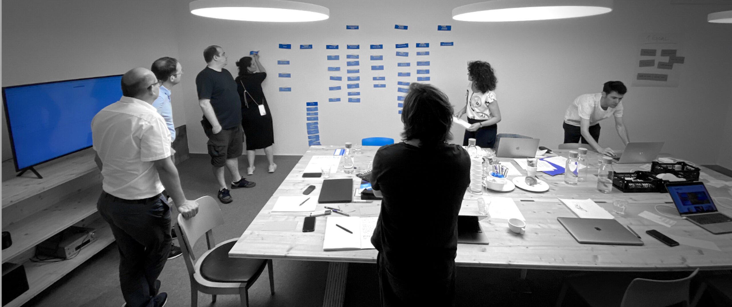 Photograph of the early workings on ISSI's new webpage with members from eyeloveyou.ch.