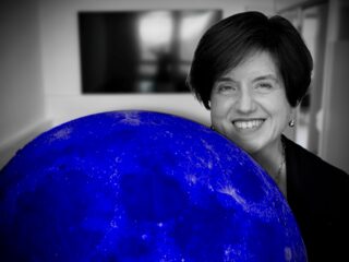 ISSI Executive Director Antonella Nota being over the Moon with the latest version of the ISSI-blue.