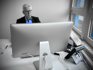 Building a website ain’t easy… ISSI Director Michael Rast looking at the first webpage draft.
